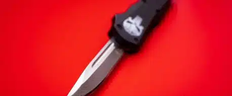 black and silver knife on red surface