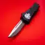 black and silver knife on red surface
